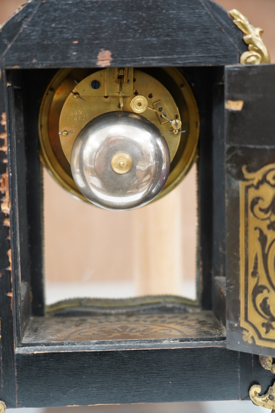 A late 19th century French boulle work mantel clock, with key and pendulum, 40cm. Condition - fair to good, generally worn, not tested as working